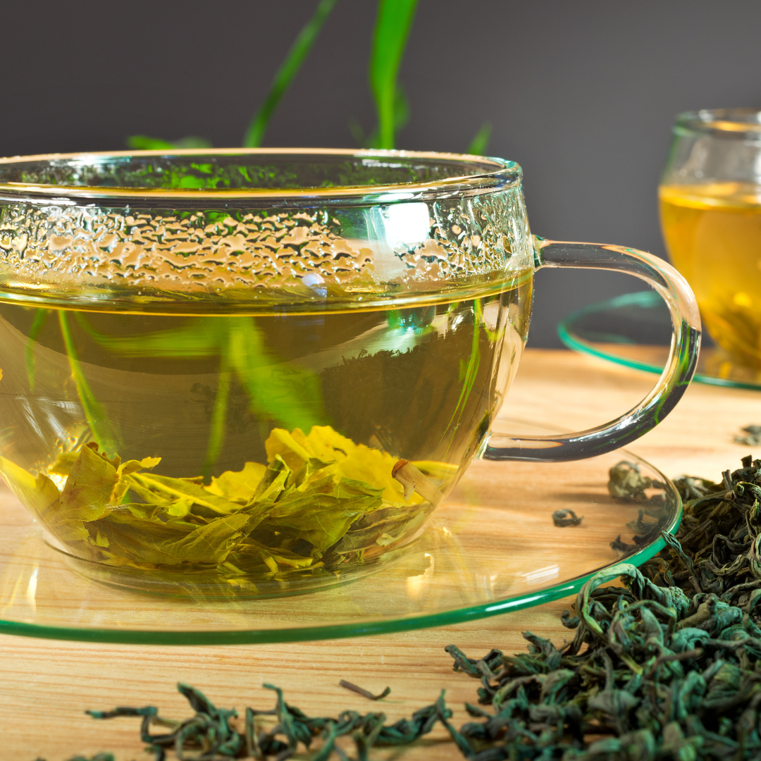 Tropical Canopy organic mango green tea in glass cup