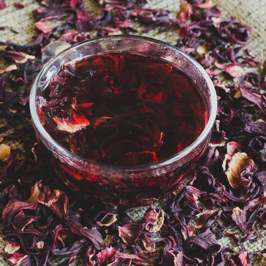 Crimson Cozy organic hibiscus spiced herbal tea in glass jar