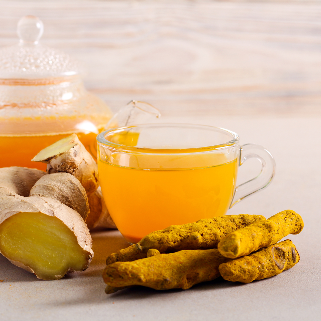Golden Roots organic turmeric ginger herbal tea in glass cup