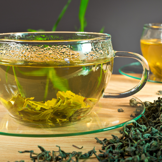 Tropical Canopy organic mango green tea in glass cup